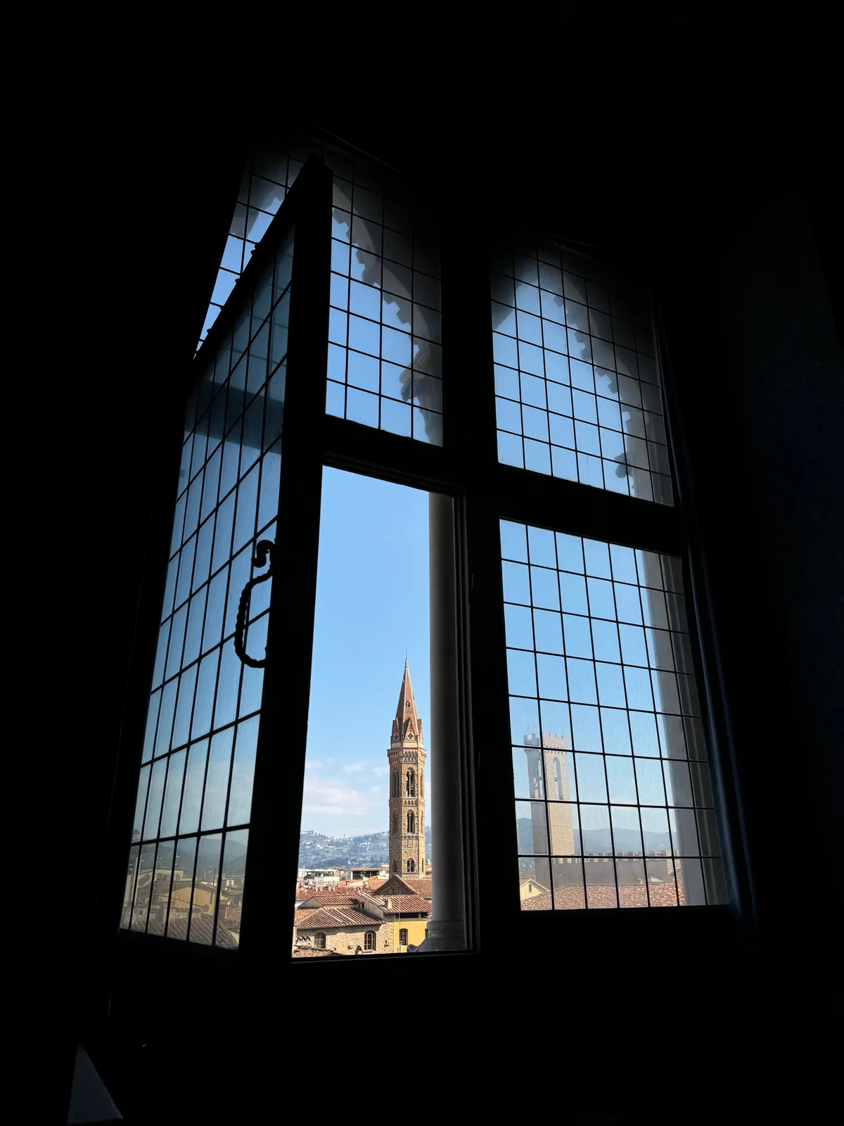 Florence cathedral framed by a tall arched window